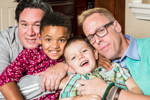 Two men sat with two children